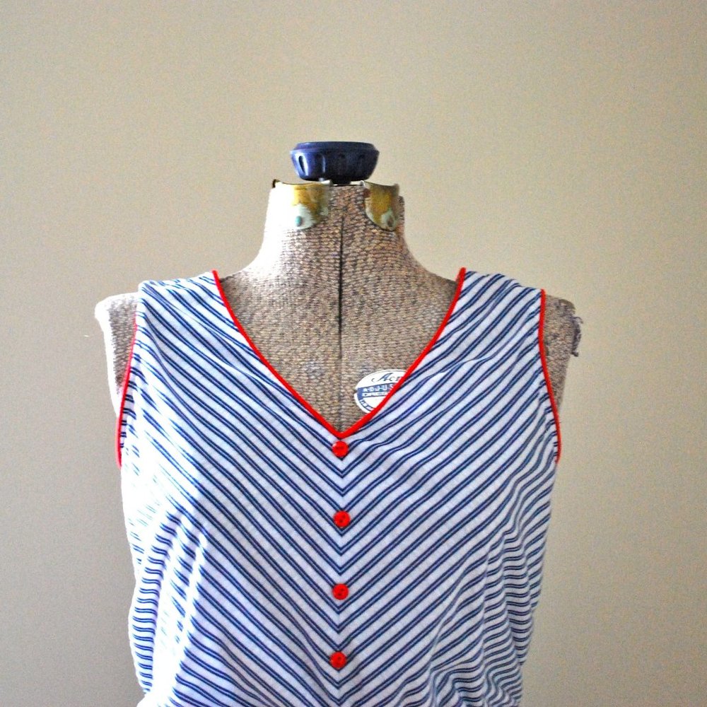 Blue and white striped dress with red buttons